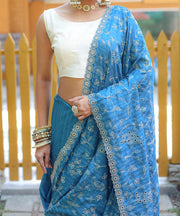 Captivating Silk Floral Design Teal Blue Color Saree